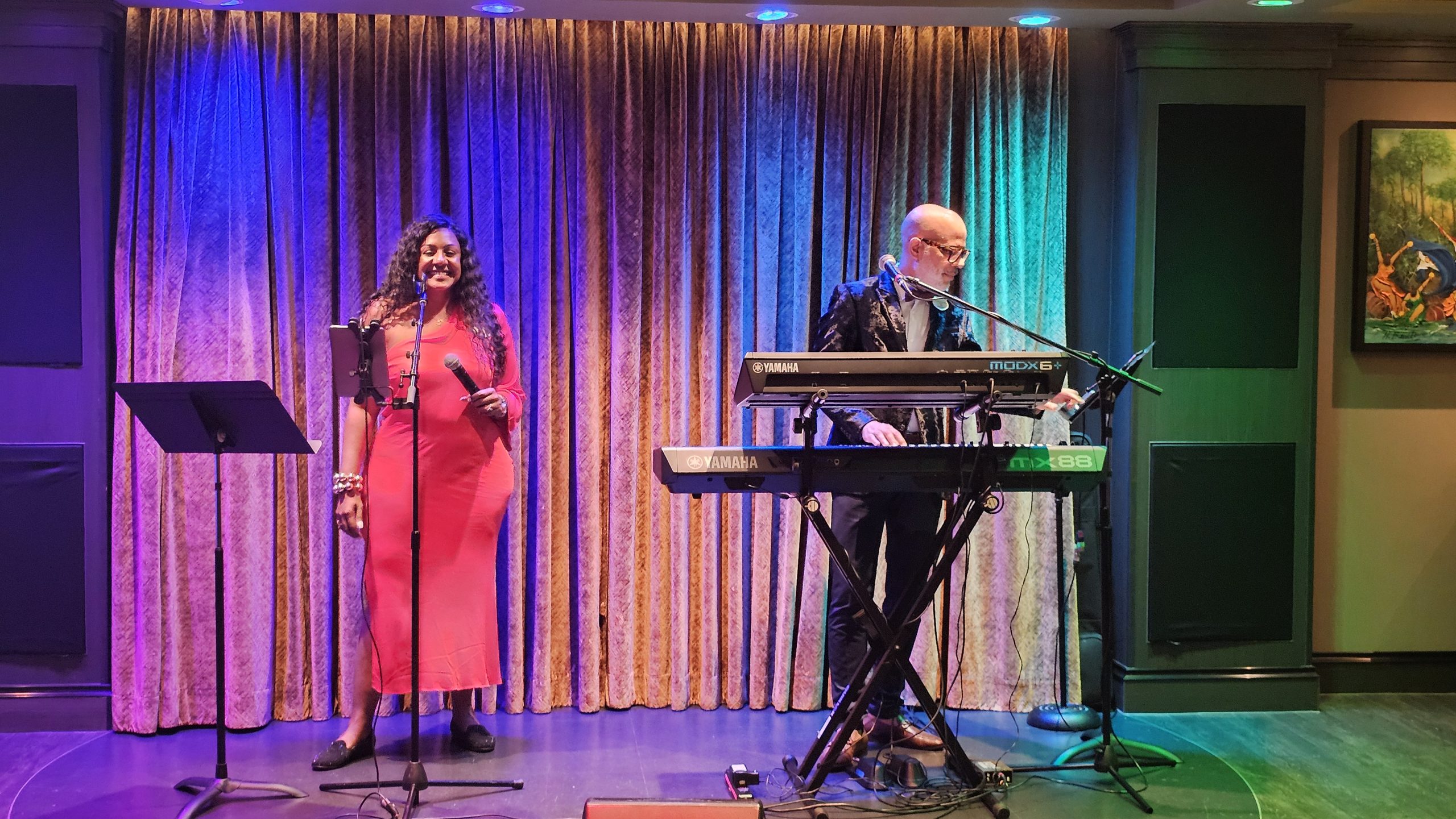 Salsa Band Musicians performing live on a cruise ship stage with colourful lighting.