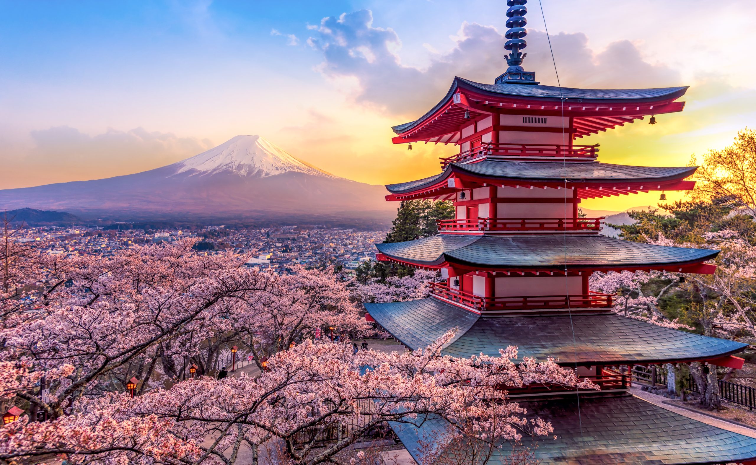 Chureito Pagoda overlooking Mount Fuji during cherry blossom season in Japan