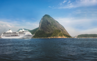 Luxury cruise ship sailing past Sugarloaf Mountain in Rio de Janeiro, Brazil