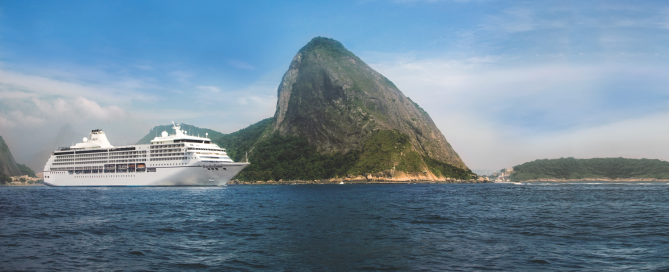 Luxury cruise ship sailing past Sugarloaf Mountain in Rio de Janeiro, Brazil