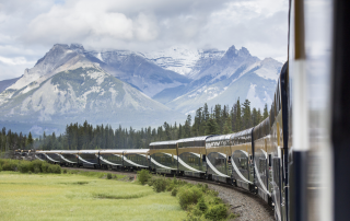 Rocky Mountaineer GoldLeaf train travelling through the Canadian Rockies before an Alaska cruise