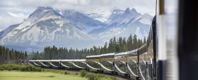 Rocky Mountaineer GoldLeaf train travelling through the Canadian Rockies before an Alaska cruise