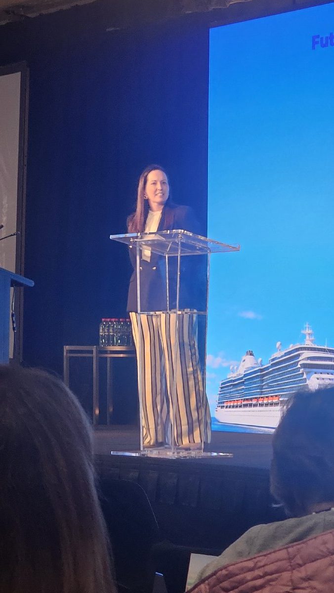 Nicole O’Sullivan speaking on stage at CLIA Cruise360 in Sydney